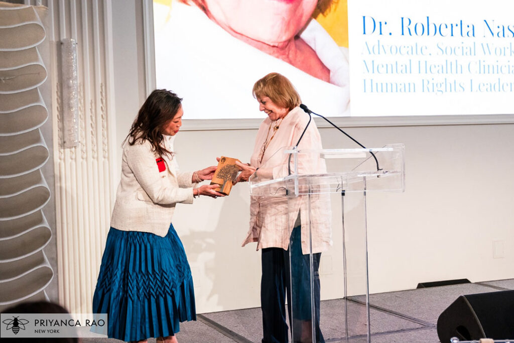 Council Member Linda Lee (left) presenting the Championing Mental Health Award to Dr. Roberta Nassar (right)